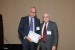 Dr. Nagib Callaos, General Chair, giving Dr. Dario Russo the best paper award certificate of the session "Management, Engineering and Informatics II." The title of the awarded paper is "Business Process Modeling and Efficiency Improvement through an Agent-Based Approach."